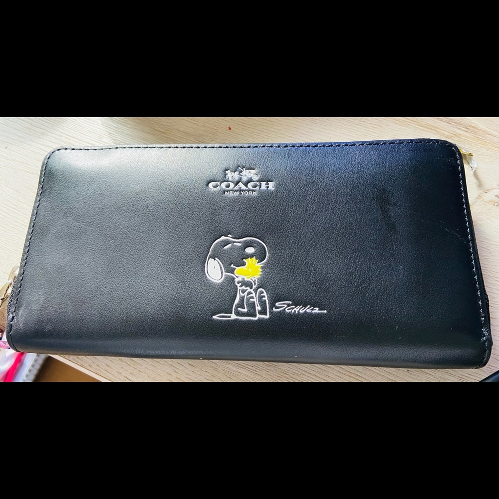 Used. Coach Snoopy wallet.